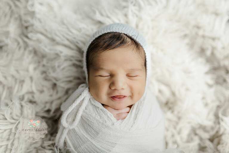 newborn baby smiles
