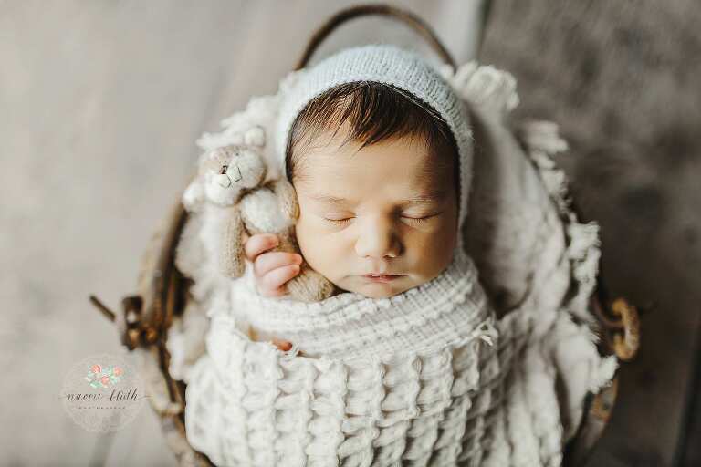 newborn photoshoot with stuffie bear