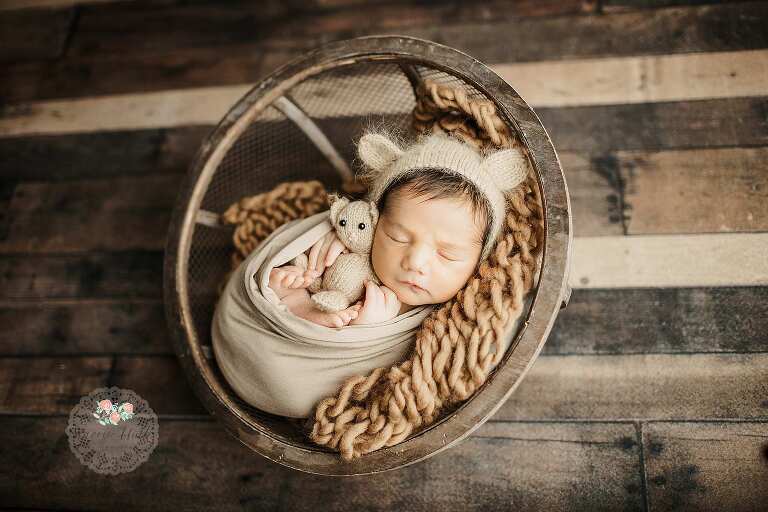 newborn baby boy in bear bonnet