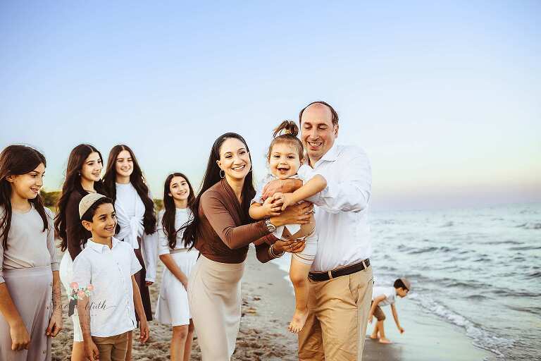 Large family portrait at golden hour sunset Boca Raton beach