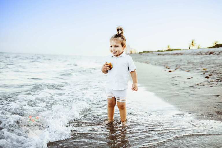 baby boy having fun at boca raton beach photo shoot